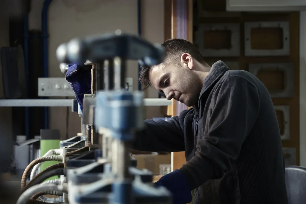 Merrell Casting Story - Employee works at the bench making jewellery