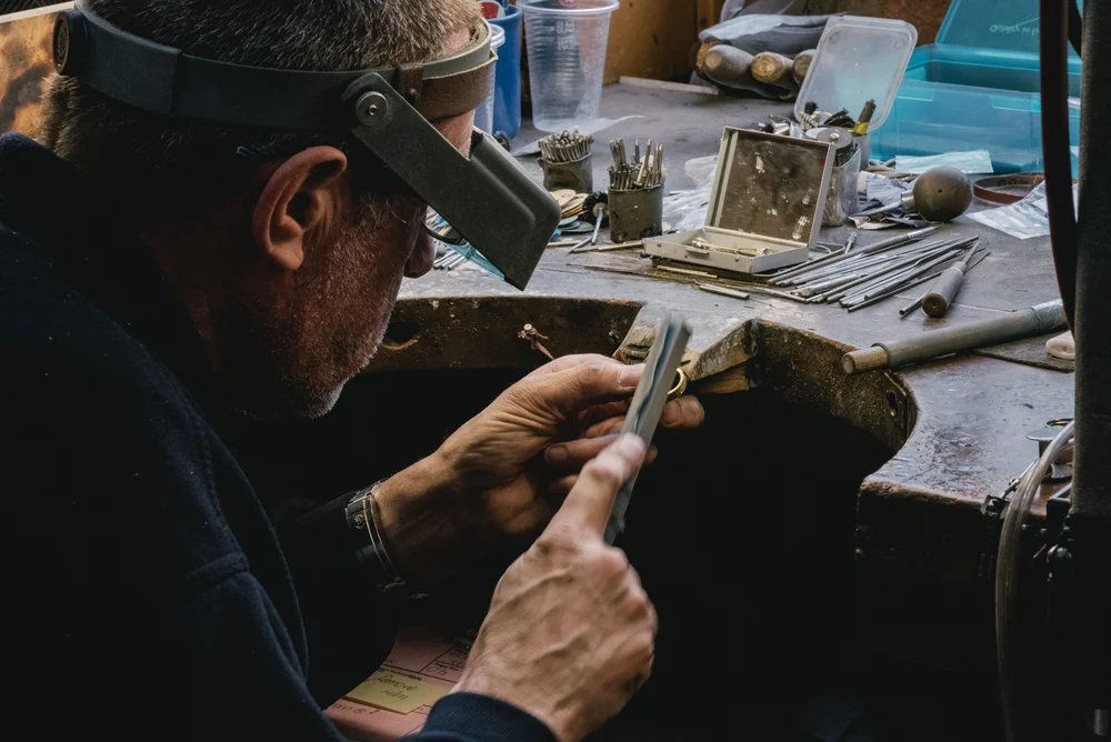 Goldsmith Working on Bespoke Ring in Jewellery Manufacturing Workshop